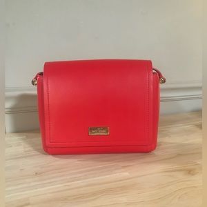 Red Kate Spade Crossbody w/flap closure